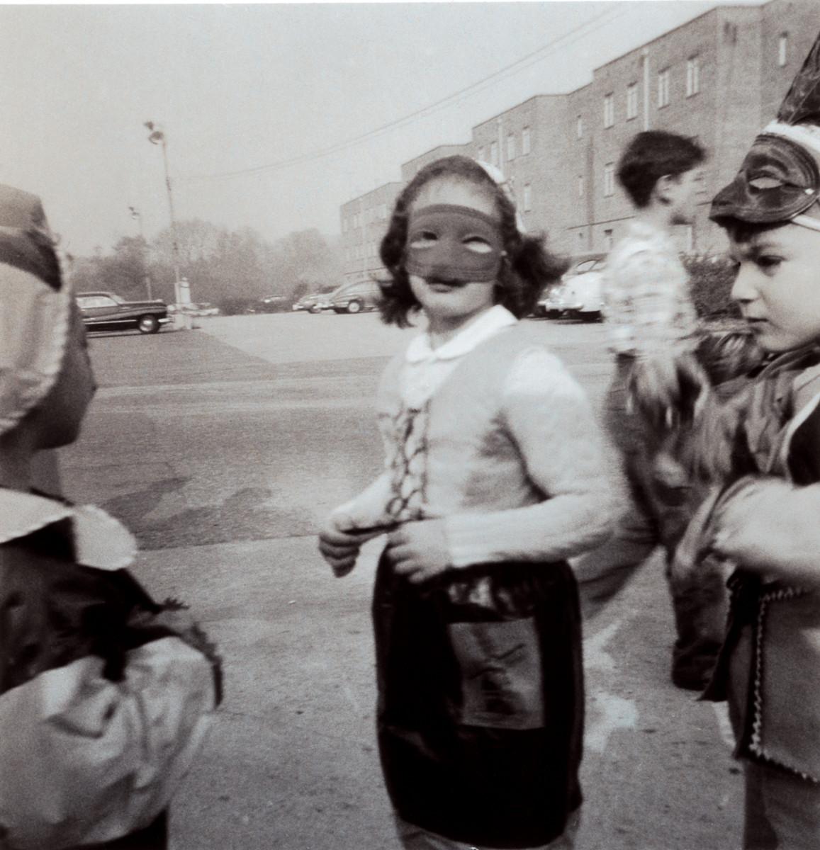 Barbara in mask, Washington DC, 1953. HYMAN GOLDIN