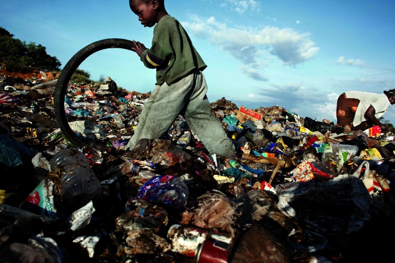 Robin Hammond, Patrick, five, lives in a rubbish dump with his grandmother. They earn on average  a month recycling waste from the dump.