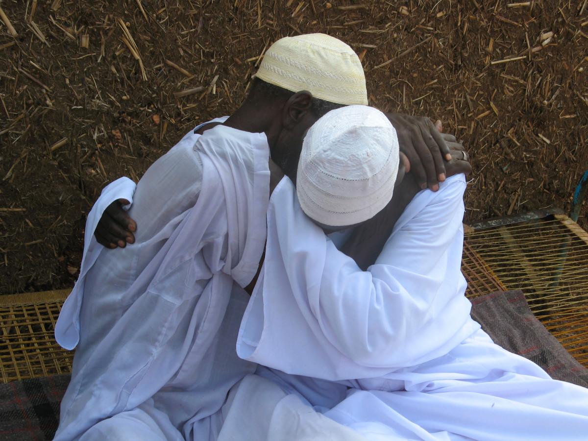 Cecilia Goin. Two brothers reunite after more than twenty years of separation, Sinnar, Sudan, 2007. Courtesy of CICR.